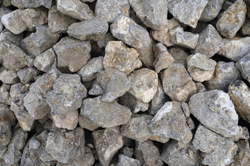 Nature background of chaotic pile of stones. Natural texture of random boulders. 