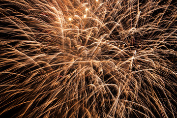 Yellow fireworks at night