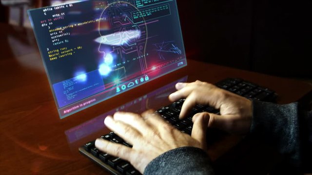 Man typing on the keyboard with artificial intelligence on hologram screen on desk. Deep machine learning technology with cyber head shape. Digital AI concept. Hand shake camera.