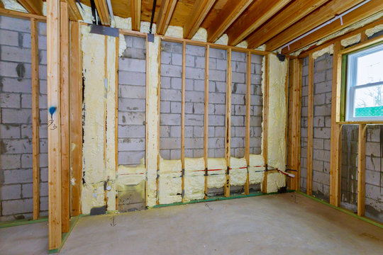 Basement Unfinished Under Construction The Wall Of A New Wooden House In Foam For Insulation