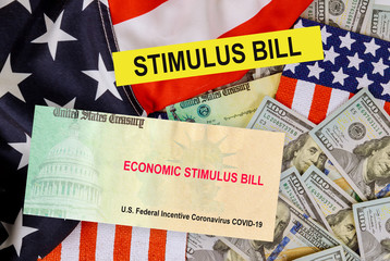 Stimulus bill USA dollar cash banknote on American flag Global pandemic Covid 19 lockdown