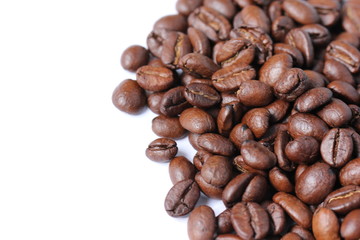 Dark roasted Arabica coffee beans on a white background