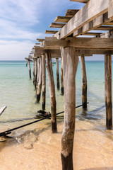 Old wood pier , Sunset beach, koh rong samloem island, sihanoukville, Cambodia.
