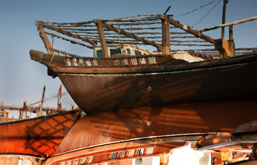 Reflection of dhow, a traditional fishing boat. The image has been roatated 180 degree to show the clear reflection on water