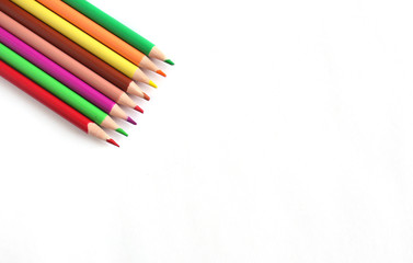 Color pencils on white background, copy space, a close up.