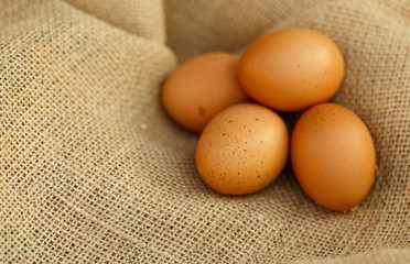 raw organic home eggs in eco sackcloth ,mock up, zero waste concept, healthy lifestyle