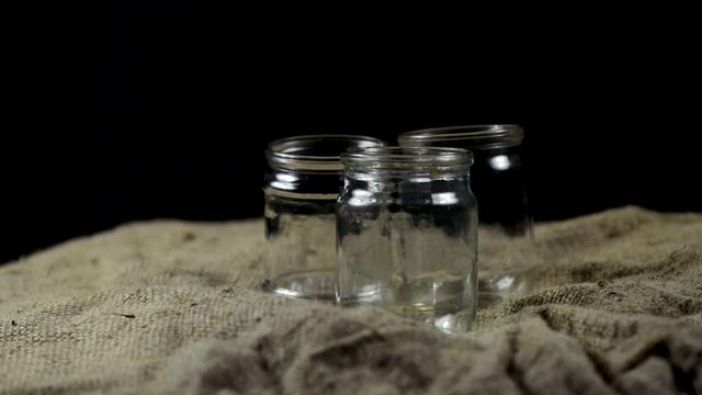 three empty glass jars