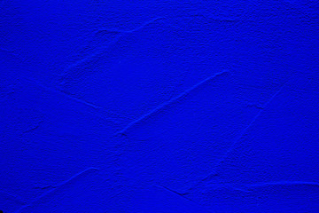 Blue colored abstract wall background with textures of different shades of blue