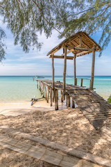 Fototapeta premium Old wood pier , Sunset beach, koh rong samloem island, sihanoukville, Cambodia. 
