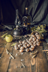 vintage wood table with a glass of nuts