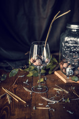 vintage wood table with a glass of nuts