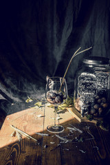 vintage wood table with a glass of nuts
