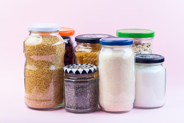 Different food in reused glass jars, zero waste plastic free concept