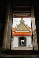 Entrance to the Wat Arun temple grounds through shadows