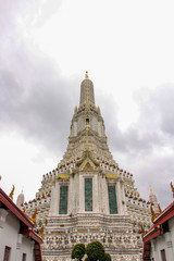 Bangkok Wat Arun Temple with gray cloudy sky