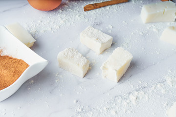 Making fried milk with sugar and cinnamon. Sweet dessert. Traditional cuisine and dessert concept