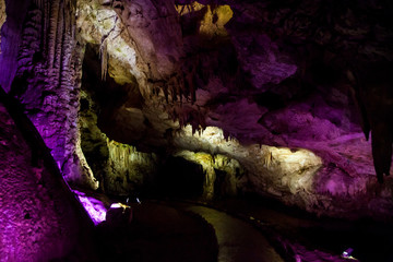 cave with rock growths with illumination
