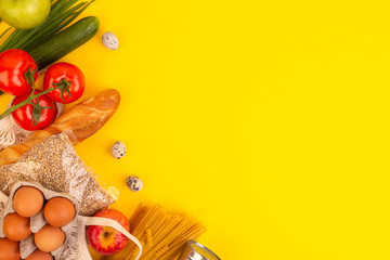 Food packaging on yellow background. Quarantine food delivery home. Flatlay banner with copyspace.