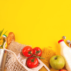 Food packaging on yellow background. Quarantine food delivery home. Flatlay banner with copyspace.