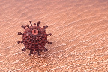 3d modeling of coronavirus, covid19 and other virus and bacterial species on leather surface.Microscopic view of epidemic diseases spreading from shakes and china on leather background.copy space