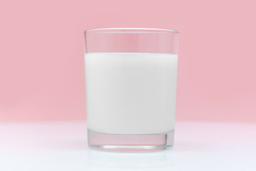 Glass of fresh milk on a pink background. Healthy eating and healthy lifestyle.