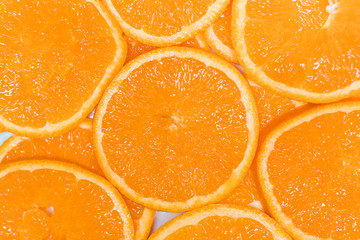 Closeup of slices of grapefruit, mandarin, orange. Food summer background, fruits top view. Fresh sliced pieces of summer fruit.