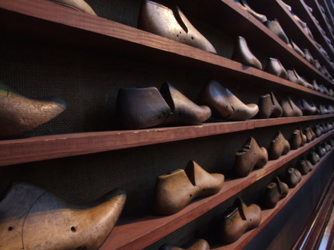 Full Frame Shot Of Shoemakers Wooden Molds In Shelves