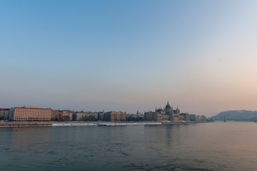 Naklejka premium The river Danube on a cold winter day with the Hungarian Parliament building in the background