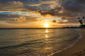 Golden sunset from the beach at Waikiki on Oahu.