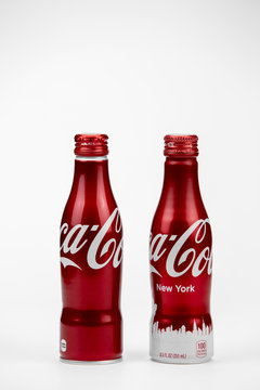 New York, USA 11/01/2020 - Two Coca-Cola Classic Design aluminum recyclable bottle isolated on a white background in studio, Coke brand.