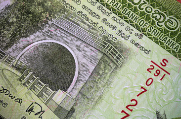 Macro photography of 1000 Sri Lanka Rupee or Rupie. Paper currency of the republic Sri Lanka. Money of the island country. Close up to the Ramboda Tunnel on the front of the banknote 