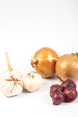 Raw garlic, red onion and big onion isolated on white background.