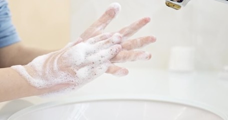 Child is washing  his hands with a hand wash gel in sink. Clean hand concept idea. Health care Coronavirus protection.Closeup view. Health care concept. 