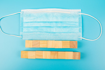 Surgical mask or Medical face mask for protection corona virus with blank wooden block