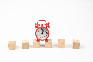 Red alarm clock with Blank wooden block