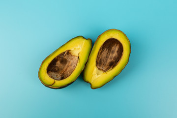 Ripe avocado isolated on blue background