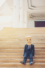 Businessman masked stress on the company stairs.