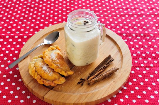 Traditional ecuadorian drink accompanied by delicious wind empanadas.