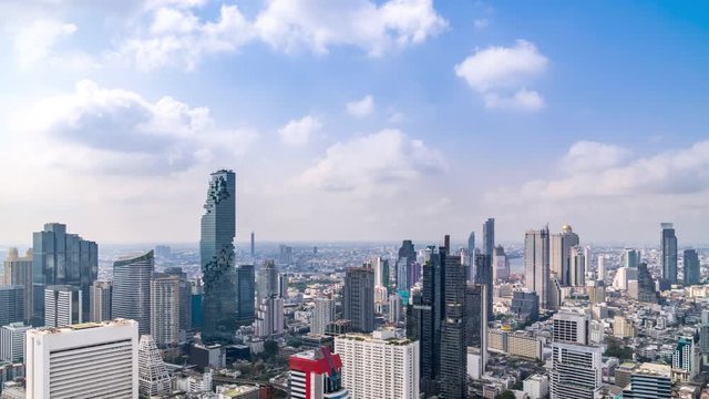 Bangkok business district city center above Silom area, with cloud pass over buildings and skyscrapers; panning right � Time Lapse