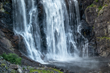 Skjervsfossen norwegian landmark high powerful cascade waterfall. Nature travel clean falling water horizontal landscape
