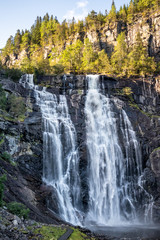 Fototapeta premium Skjervsfossen norwegian landmark high powerful cascade waterfall. Nature travel clean falling water vertical landscape 