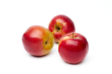 Fototapeta na wymiar Three red apples isolated on a white background