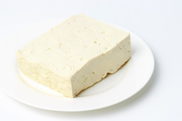 soy tofu on a plate on a white background, close-up