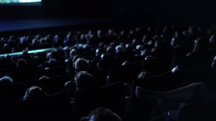 Large crowd of people in a cinema - film performance in a movie theater