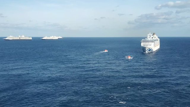 Bimini, Bahamas - 23 April 2020: meeting cruise ships in open sea to exchange provision and transferring crew