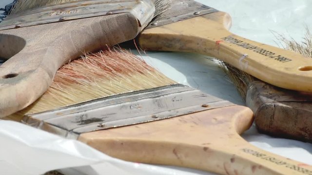Big paintbrushes on a table
