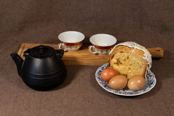 Still life with easter eggs, cake and teapot 