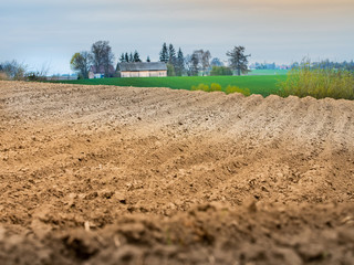 Plowed field view of the mountainous area in the countryside