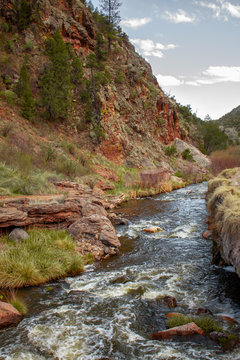 River runs at the base of cliff in Jemez Springs, New Mexico