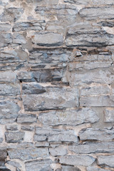 Old weathered limestone stone wall textured natural background